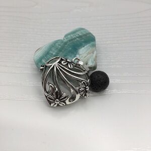 Heart & Flower Aromatherapy Silver tone Locket.  Lava stone included.